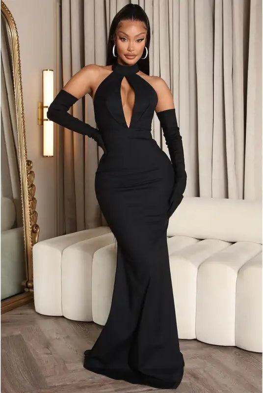 Elegant black halter gown with gloves showcasing a sexy backless cutout design