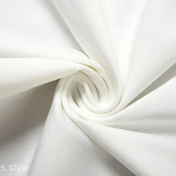 Swirling white fabric highlighting the sexy oblique shoulder design of the fit hip dress