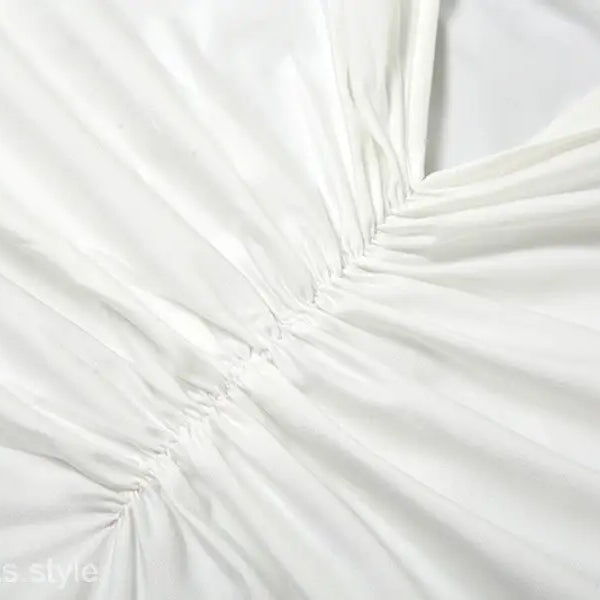 White gathered fabric of elegant oblique shoulder backless fit hip dress for summer