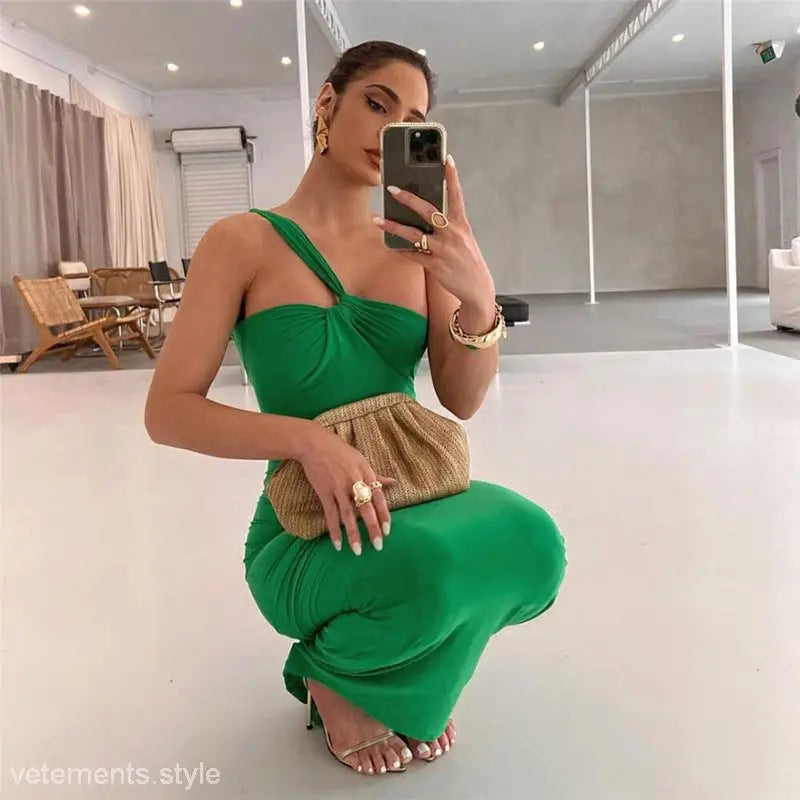 Elegant oblique shoulder backless green dress showcasing a sexy oblique shoulder fit hip dress