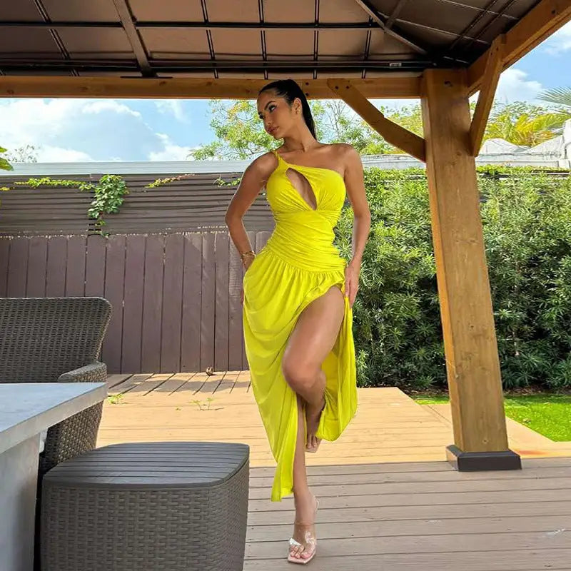 Woman in yellow one-shoulder elegant sexy slit dress for parties and clubs
