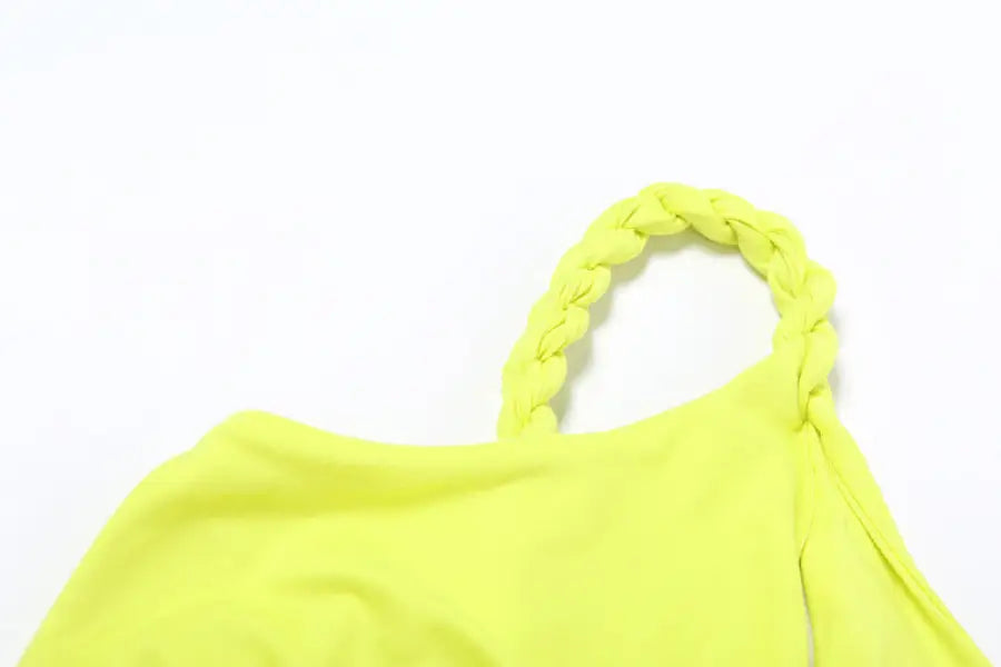 Neon yellow one-shoulder top with braided strap, ideal for elegant sexy slit dress events