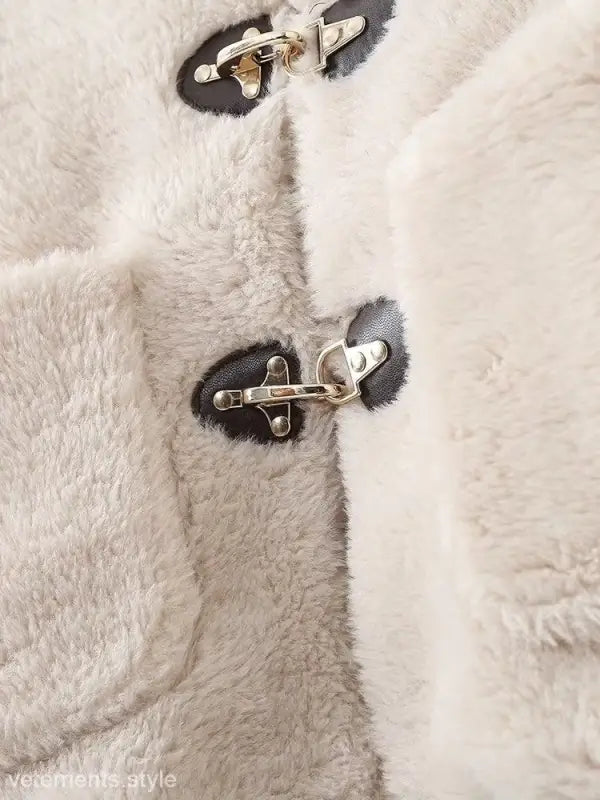 Fluffy white coat with toggle closures, ideal as an Elegant Ornament Fleece Jacket