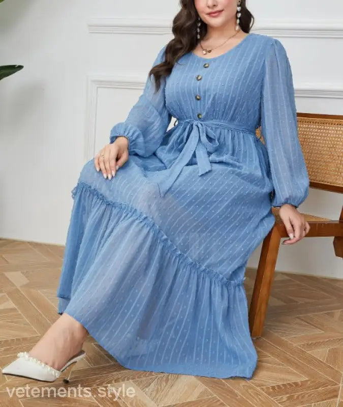 Blue long-sleeved tiered maxi dress showcasing lace details from the Elegant Sky Dress