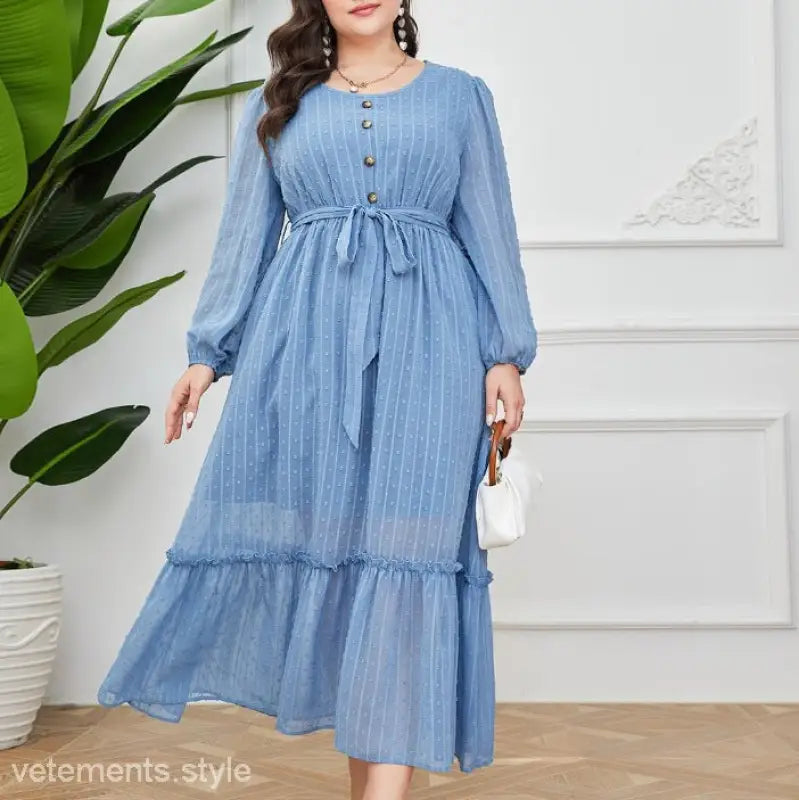 Light blue long-sleeved Elegant Sky Dress featuring a tie waist and lace details