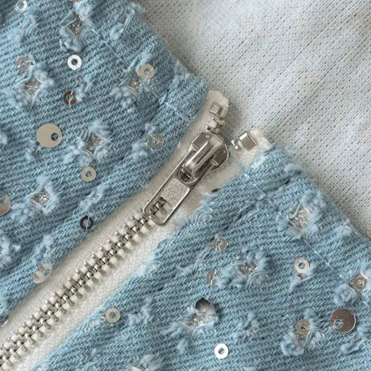 Light blue denim fabric with silver sequins and zipper for elegant denim wide leg pants