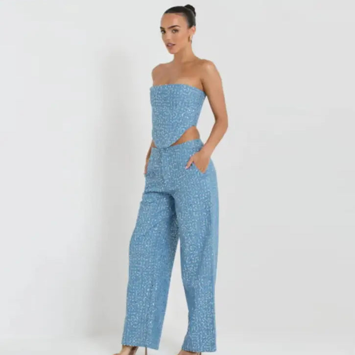 Elegant sleeveless top with light blue sequined two-piece set featuring wide leg pants