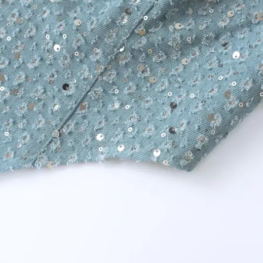 Light blue sequined fabric with seam, ideal for elegant denim and wide leg pants style
