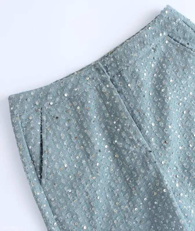 Light blue sequined wide leg pants with pockets, perfect for elegant denim fashion