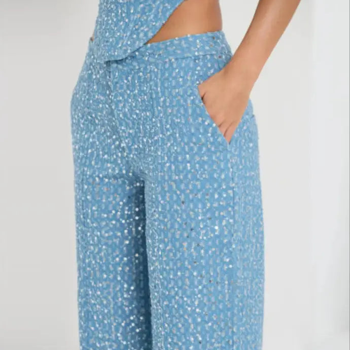 Light blue sequined wide leg pants with pockets, ideal for elegant denim style
