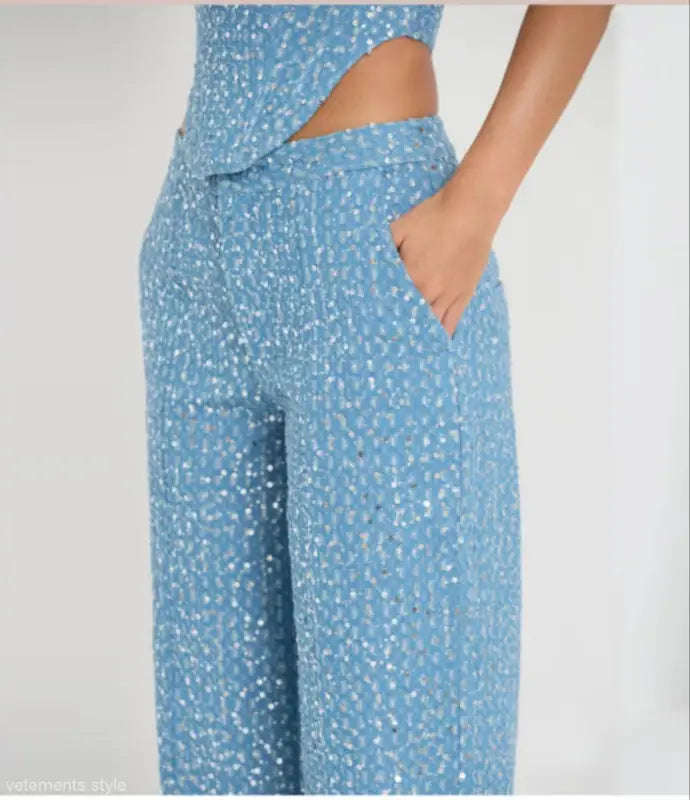 Light blue sequined wide leg pants with pockets, ideal for elegant denim style
