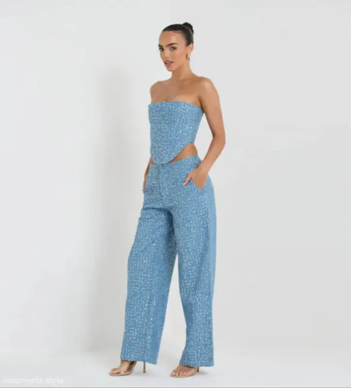 Light blue sequined two-piece set with strapless asymmetrical corset top and wide leg pants