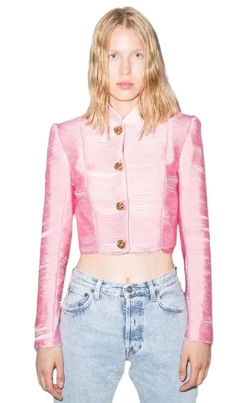 Pink cropped jacket with gold buttons styled over light blue jeans, ideal tassel short jacket