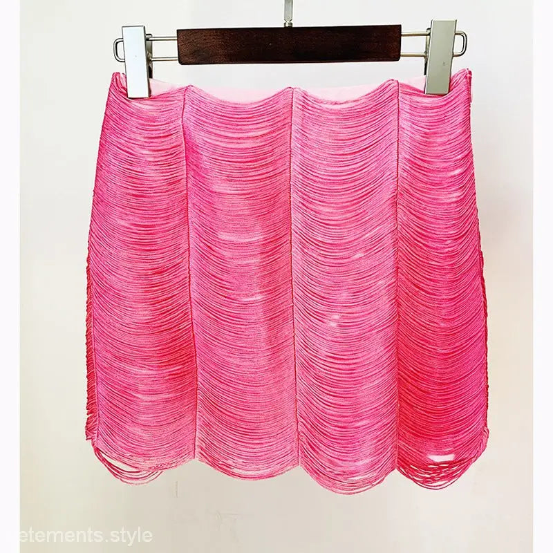 Pink layered mini skirt with ruched texture hanging on hanger, perfect for stars tassel short style