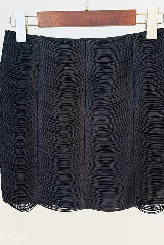 Black textured mini skirt with horizontal pleated layers, part of Stars Tassel Short Jacket set