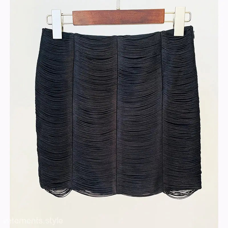 Black textured mini skirt with horizontal pleated layers, part of Stars Tassel Short Jacket set