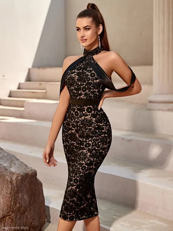Elegant slim dress featuring black lace, halter-neck design, and knee-length hem