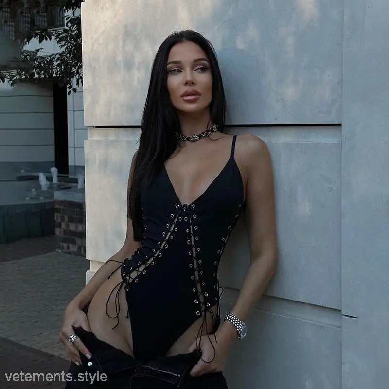 Woman wearing an elegant slim fit corns tied jumpsuit with lace-up bodysuit and choker