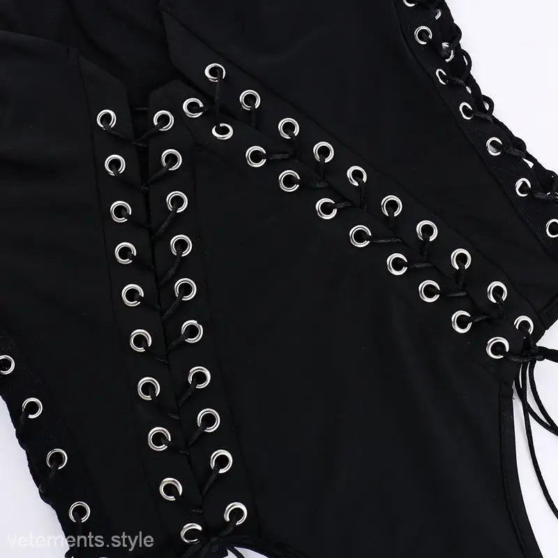 Elegant slim fit corns tied jumpsuit featuring black fabric with silver grommets and lacing