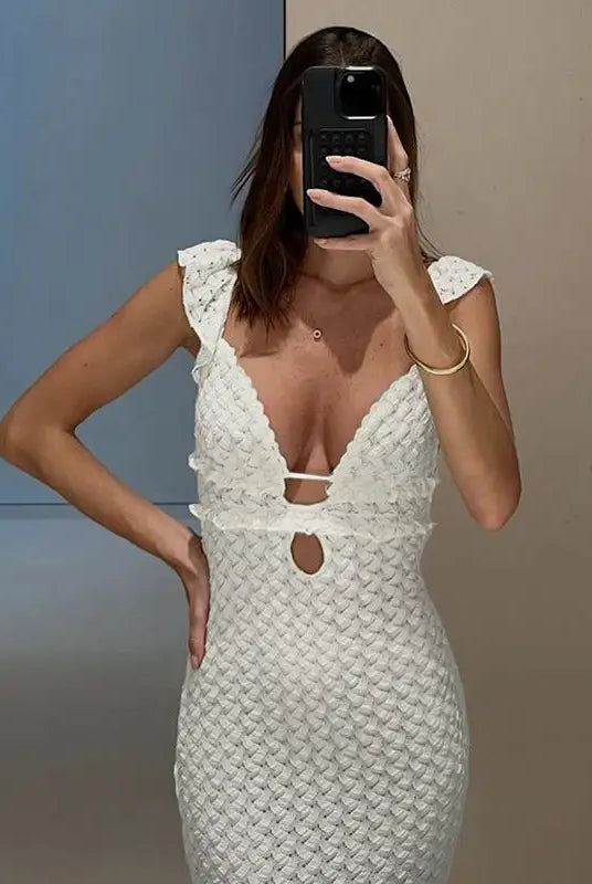 White textured elegant slim fit evening dress featuring a plunging backless V-neck design