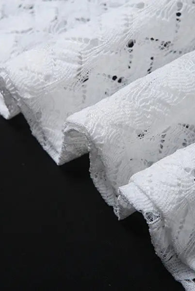 Delicate white lace fabric on an elegant slim fit evening dress with backless V-neck design