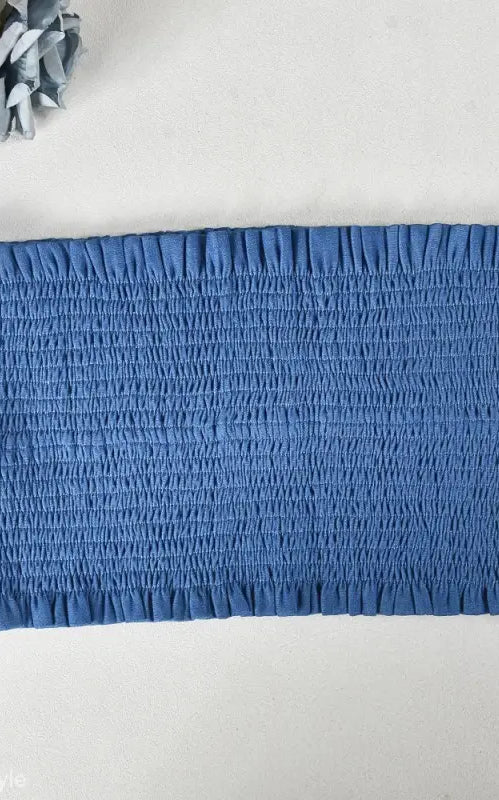 Blue shirred tube top showcasing elegant slim pants suit with ruffle and smocked strapless design