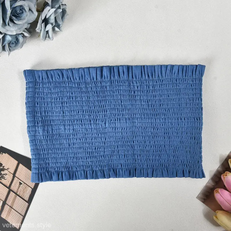 Blue shirred tube top showcasing elegant slim pants suit with ruffle and smocked strapless design