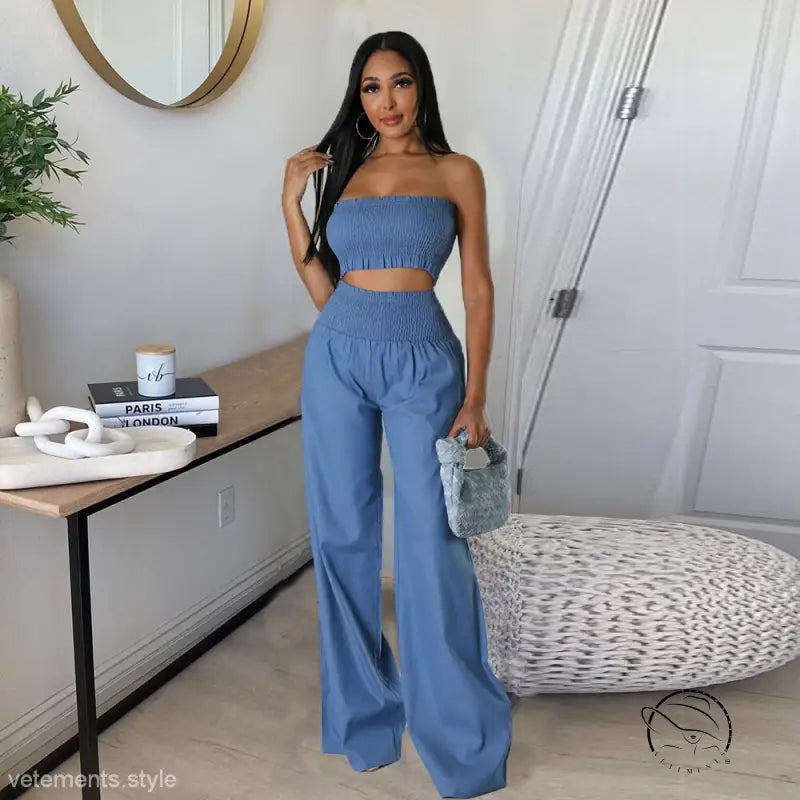 Woman in sexy slim pants suit with ruffle strapless design