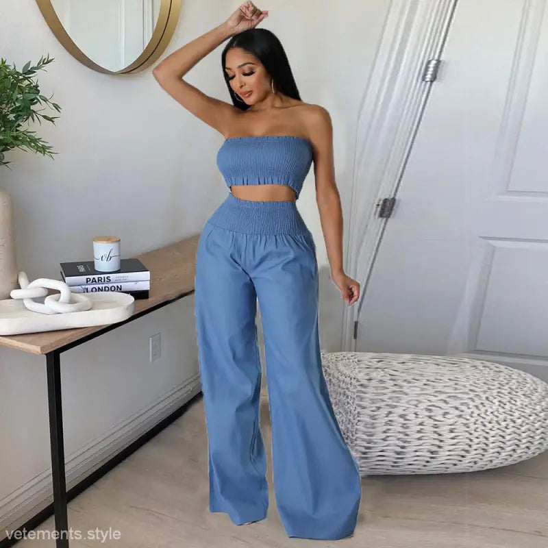 Elegant slim pants suit with ruffle and smocked strapless design worn by woman