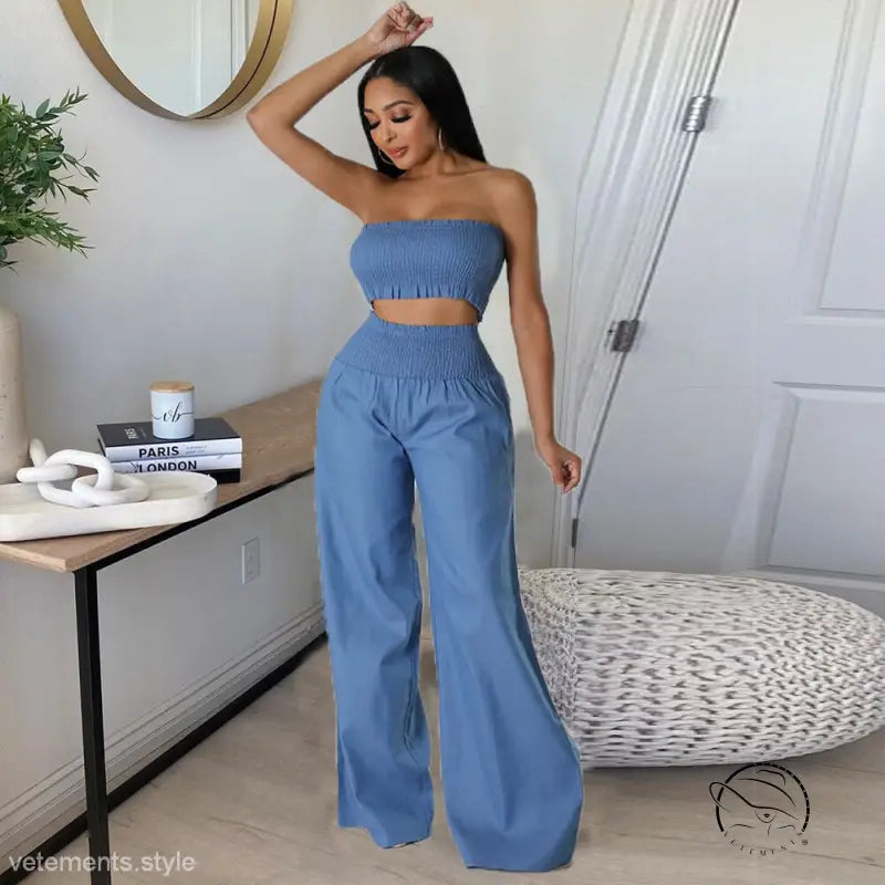 Woman in sexy slim pants suit with ruffle strapless design