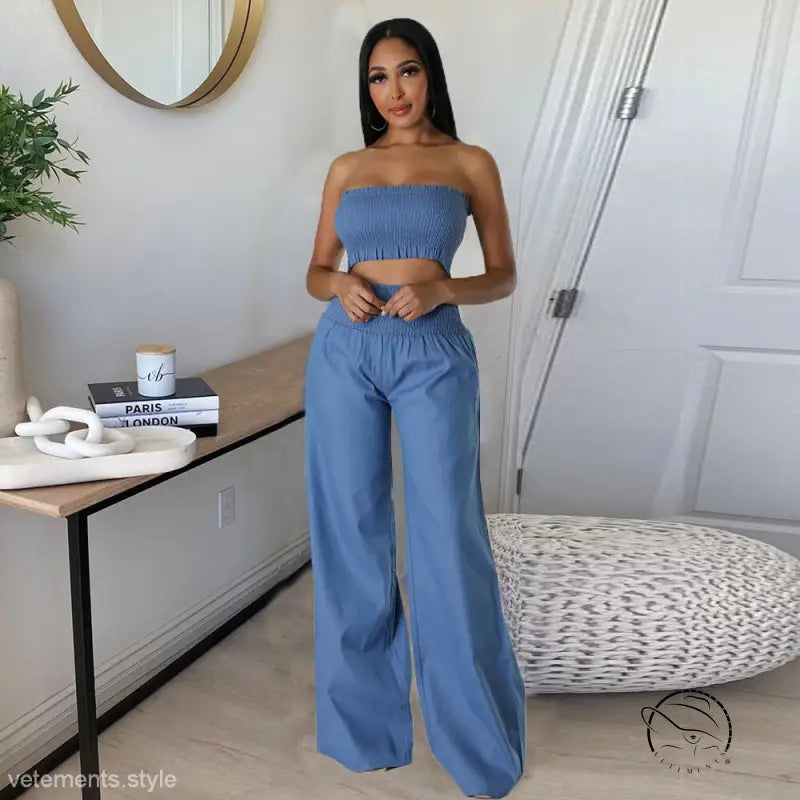 Woman in sexy slim pants suit with blue ruffle strapless design