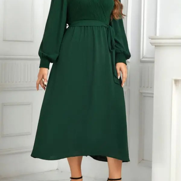 Emerald green elegant slimming evening dress with belted V-neck and long sleeves