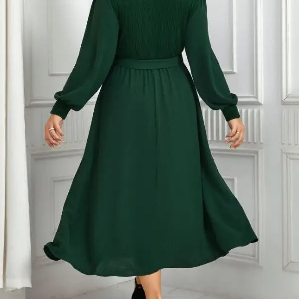 Emerald green elegant slimming evening dress with belted V-neck and long sleeves