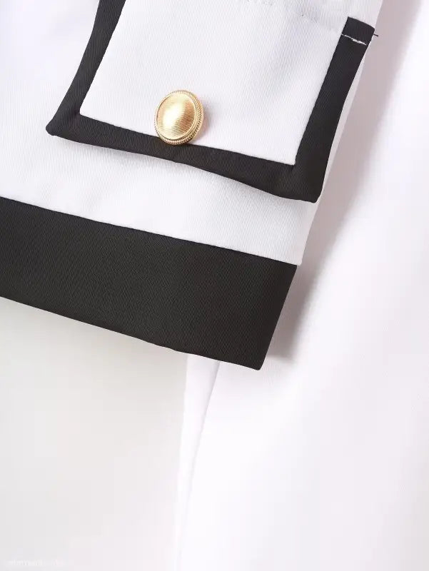 White blazer suit with snow white blazer sleeve, black trim, and gold button detail