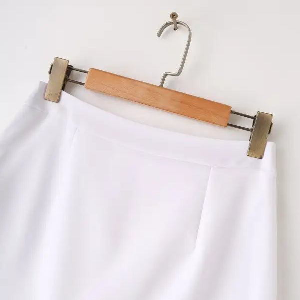 White skirt on hanger paired with Elegant Snow White Blazer for Spring and Fall Wear
