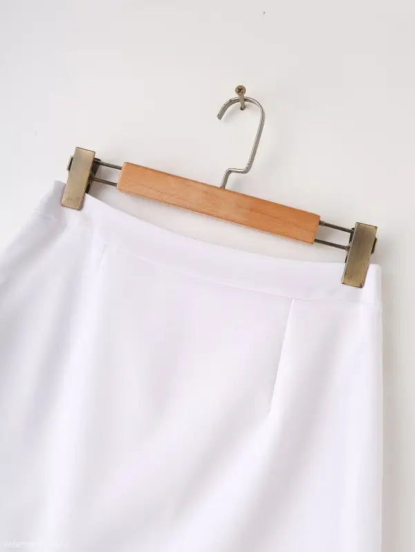White skirt on hanger paired with Elegant Snow White Blazer for Spring and Fall Wear