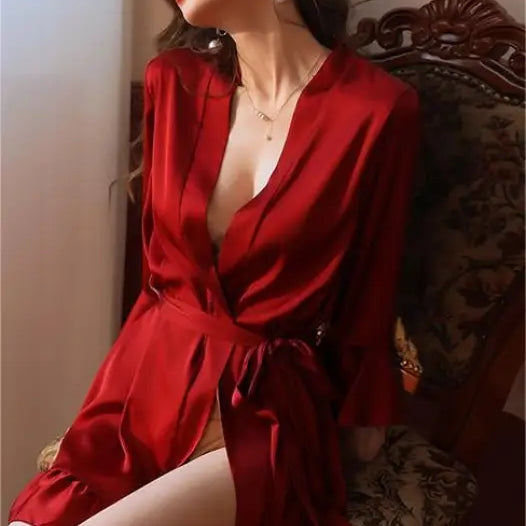 Woman in vibrant red silk lotus pajamas with plunging neckline from Elegant Spandex Ruffle Dress