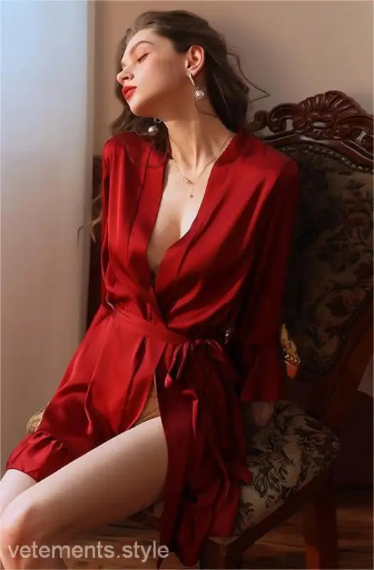 Woman in vibrant red silk lotus pajamas with plunging neckline from Elegant Spandex Ruffle Dress