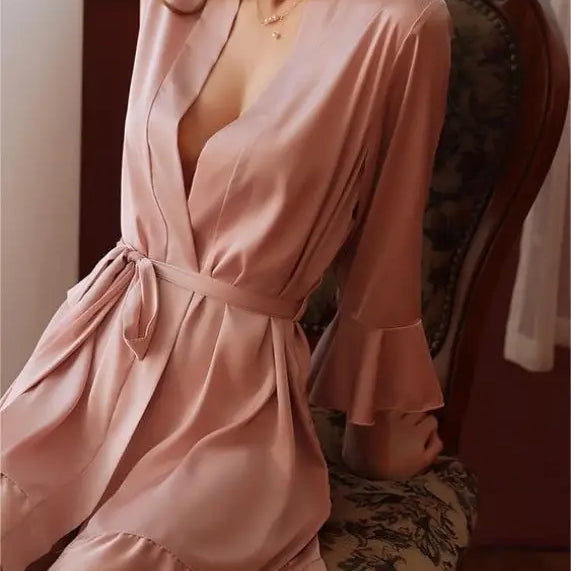 Pale pink silk lotus pajamas with plunging neckline, ruffled sleeves, and belt for spring fall