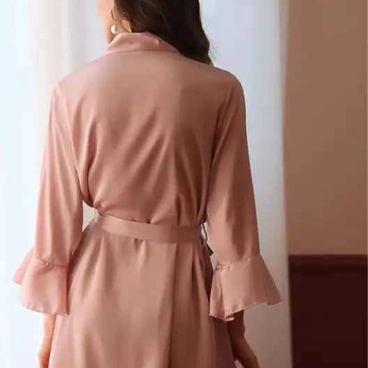 Pink robe with ruffled sleeves and hem, tied at waist, ideal for sexy silk lotus pajamas
