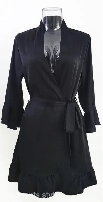 Black wrap dress with three-quarter sleeves and ruffled hem for elegant spring and fall wear
