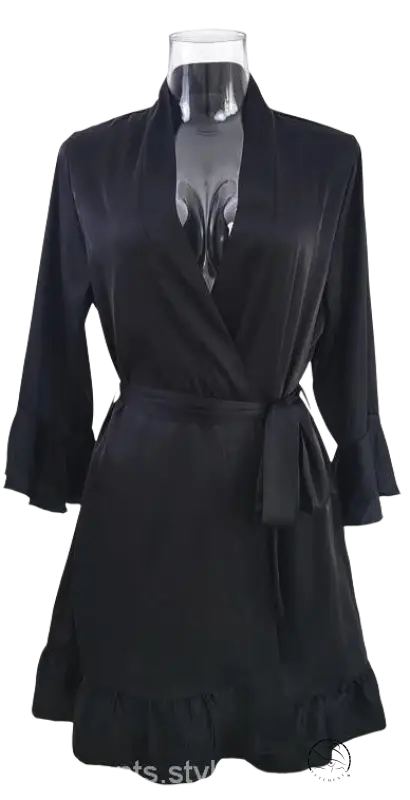 Black wrap dress with belted three-quarter sleeves and ruffled hem
