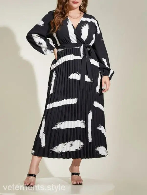Black and white pleated maxi dress featuring abstract pattern, Elegant Tala Dress with Belted V-Neck