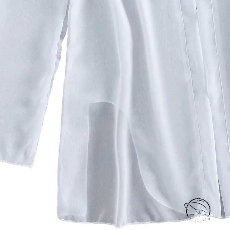 Elegant three piece sexy bikini with white flowing slit fabric on wood