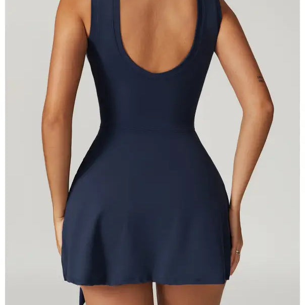 Navy blue sleeveless mini dress with a low-cut back.