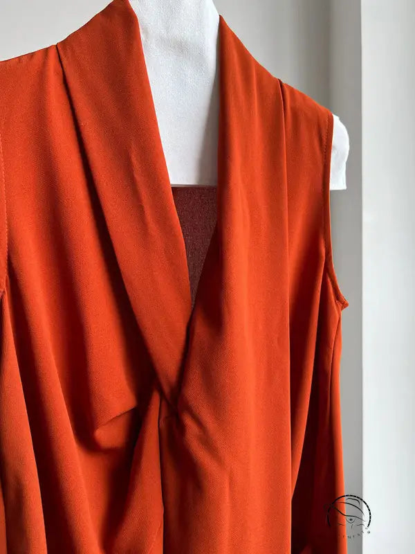 Elegant v neck long dress in bright orange with flowing folds