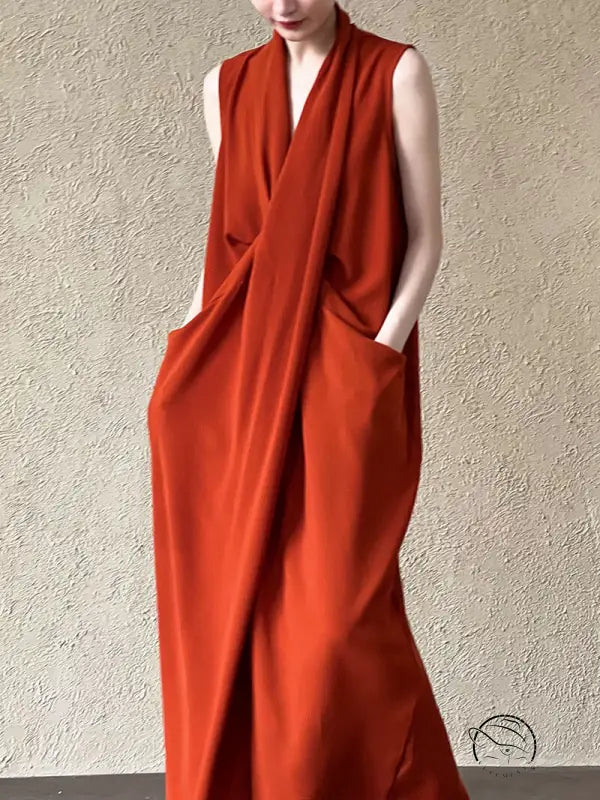 Elegant v neck long dress: sleeveless rust maxi with draped wrap and pockets