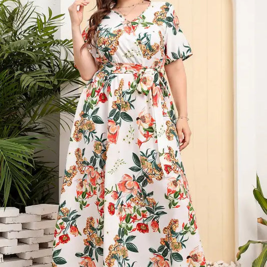 Floral print maxi dress with short sleeves and a belted waist.