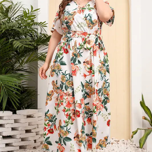 Floral print wrap dress with short sleeves and a belted waist.