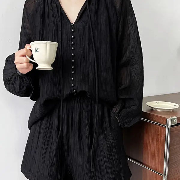 Black textured pajama set featuring a comfy shirt wide and versatile wide leg shorts